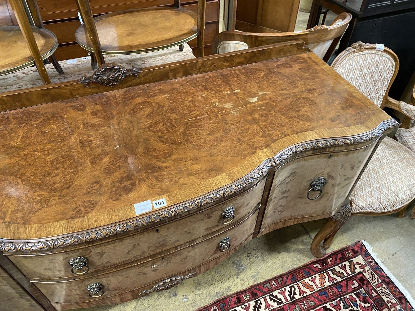A Queen Anne revival banded walnut serpentine fronted sideboard, length 167cm, depth 56cm, height 99cm